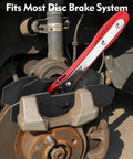 Front view of Witaxima brake caliper compression tool with red lever and extra plates for disc brakes.