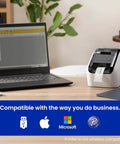 Turbo Fast Label Printer For Shipping And Address Labels With Auto Cutter, Crisp 300 DPI Black And Red Output, next to a laptop