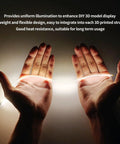 Hands holding Epic 300mm Silicone COB LED Strip Light Kit for 3D printer accessories, showing USB connection and flexibility.