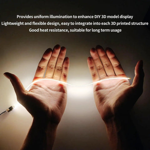 Hands holding Epic 300mm Silicone COB LED Strip Light Kit for 3D printer accessories, showing USB connection and flexibility.