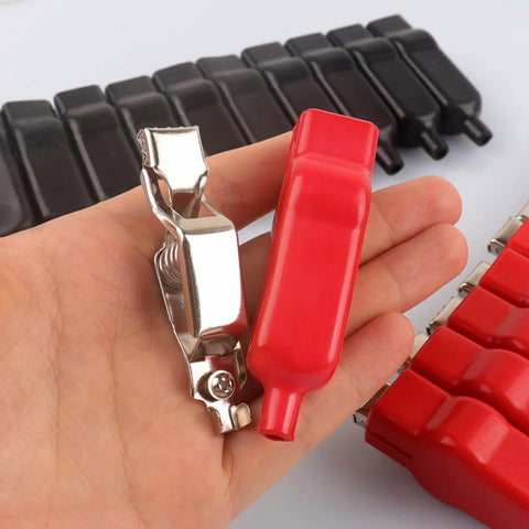 Hand holding red Heavy Duty 20 Amp Insulated Spring Loaded Alligator Clips For Electrical Testing, Truck Battery Connection