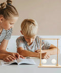 Children using Two-Piece Physics Experiment Kit For Students, Engaging Science Tools For Classroom And Home Learning on desk.