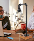 Industrial Desk Lamp With Bulb Included, 3-Way Dimmable, USB ports, Edison design on a wooden base, used on a desk in a study.
