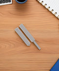 Hidden Push Latch Kit Four Piece for Closet Doors and Cabinets on a desk, showing two latch pieces, perfect alignment, quiet close.