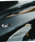 Elastic Shock Absorbing T Handle Draw Latch Rubber Hood Lock for coolers and marine gear shown on a hood