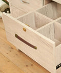 Open drawer with brown leather pull installed, part of Leather Drawer Pulls Set Of 2 With Mounting Screws Brown PU Leather Trunk Handles And Cabinet Pulls For Drawers Suitcases And Luggage Durable Wear Resistant Hardware.