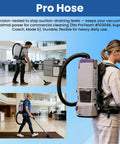 Person using Static Dissipating Backpack Vacuum Hose With One And A Half Inch Cuffs, Sixteen Inch Length, Includes 90 Degree Elbow, Compatible With Super Coach Mode 6 And Other Vacuum Models, Replacement Stretchable Hose 107648 in an office setting.