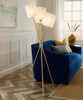Gold Tripod Floor Lamp With Three Lights, Modern E26 Ready, LED Compatible, Fabric Shade beside blue sofa in living room.