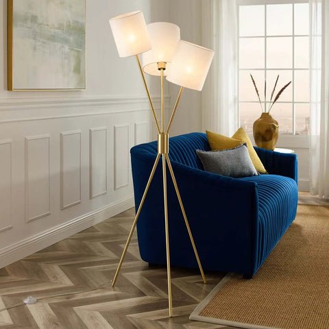 Gold Tripod Floor Lamp With Three Lights, Modern E26 Ready, LED Compatible, Fabric Shade beside blue sofa in living room.