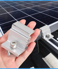 Person holding a clamp from 10 Piece Solar Panel End Clamps Set With Z Brackets For PV Mounting System Aluminum Rail Clips.