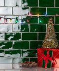 Viva Antic Verde 3x6 Ceramic Wall Tile With Dope Glazed High Sheen Finish in a decorative Christmas scene with lights