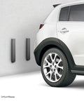 Heavy Duty Wall Guard Protectors And Bumpers For Garage Parking Spots Workshop Doors Hella Tough Rubber Foam Impact Shield Dark Grey 16 Inch 2 Pack on wall beside a parked car.