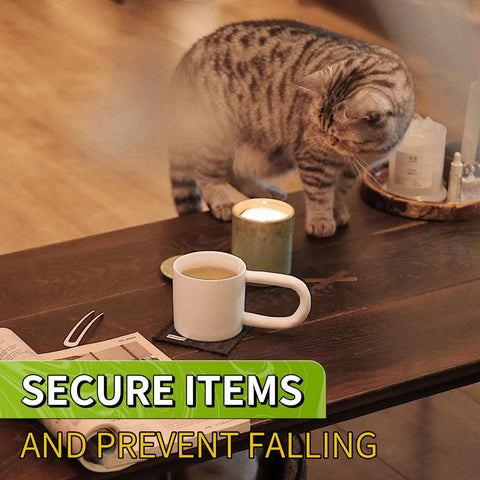 Tabletop scene with a cat beside a candle and mug, promoting 350 Pcs Double Sided Clear Adhesive Dots 0.8 Inch Removable Waterproof Mounting Putty.