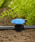 Five Pack Half Inch Drip Irrigation Shut Off Valves Inline Barbed Cut Off Valves For Garden Irrigation System Fits Half Inch Tubing 570 To 620 ID Durable One Piece Construction shown in garden setting with greenery