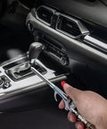 Using the 9 Piece 2 Way Air Nozzle Blow Gun Set With 1/4 Inch Quick Fitting And Four Nozzles in a car interior for cleaning.