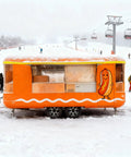 Kickstart Your Street Food Hustle With This Commercial Grade Mobile Food Truck Trailer equipped with stainless steel prep areas in snow.