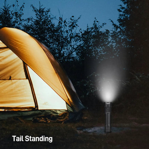 Rechargeable 4720 Lumen LED Flashlight With USB-C, 6 Modes, IPX8 Waterproof, standing illuminated near camping tent