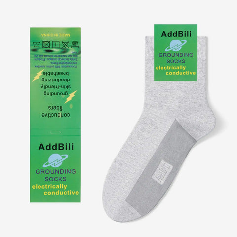 Pro Grade Men's Grounding Socks Accessory Bundle With Eight Real Pure Copper Solid Earthing Screws And Matching Screwdriver For A Locked-In Fit On Any Conductive Shoe Model Coming In Fresh White Finish displayed with package.