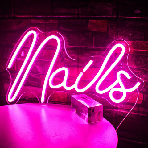 Pink Neon Sign LED Wall Light For Nail Salon And Beauty Room Decor USB Powered glowing pink 'Nails' sign against brick wall