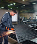 Person using Compact 18V Brushless Cordless Angle Grinder With 125 MM Disc and Rock Solid Dust Resistant Design for cutting metal.