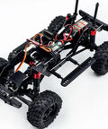 Built Different 1/18 Scale Brushless Rc Truck Crawler Rtr showcasing the chassis with steel core gears and portal axles.