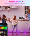 Family dancing with Smart WiFi RGB Deck Lights Kit 30 Pack For Outdoor Patio And Steps, music sync mode, app control shown.