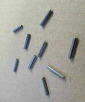 Pro Grade Stainless Steel Split Roll Pins 5/64 By 7/8 Inch, 25 Pack scattered on textured surface