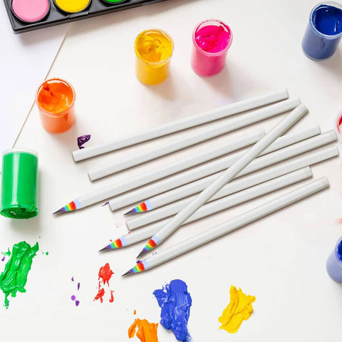 Rainbow Paper Pencils Set 24 Pieces Number 2 HB Graphite Pencils With White Barrels and colorful tips on art supplies table