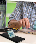 Person using Anti Static Circuit Board Holder And PCB Storage Rack for Secure Electronic Projects, with Lightweight Design.