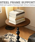 Vintage Round End Table With Solid Wood Top And Metal Base 15 Inch Wide Modern Side Table in living room with stacked books