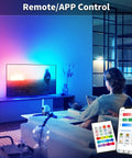 Living room with Bluetooth LED Strip Lights For Bedroom 32.8 Feet With Remote And 24V Power Supply, app-controlled lighting effects.