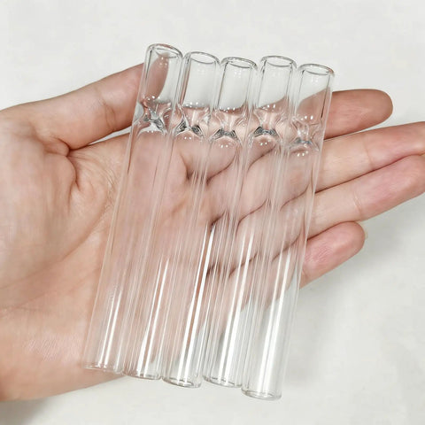 Five Piece Beefy Borosilicate Glass Tubes, 4 Inch Length, 2mm Wall Thickness, held in hand, showcasing clarity and durability.