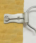 Heavy Duty Zig Zag Spring Repair Kit For Couches Chairs And Beds With Sturdy Iron Brackets close-up of a metal clip on wood