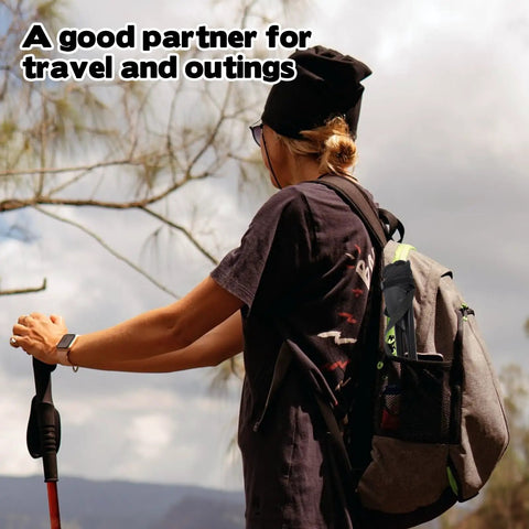Person holding a trekking pole with a backpack featuring a lightweight travel folding tripod camping stool portable chair inside
