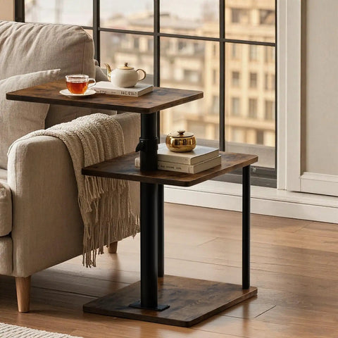 C Shaped End Table With 360 Degree Swivel Height Adjustable Sofa Side Table With Storage Open Shelf 3 Tier Night Stand TV Tray For Small Spaces Rustic Brown Living Room Bedroom beside a sofa by a window with tea and books on the table.