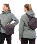 Person wearing Sidecountry 32 Camera Backpack With Modular Top Loader Inserts Black And White Versatile Everyday Gear Carrier For Pro Photogs