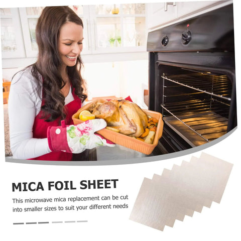 Woman placing dish in oven, showcasing 10 Piece Mica Plates 150x120mm Microwave Heat Insulation And Fireproof Sheets for kitchen use.