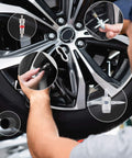 Mechanic using Ultimate Tire Valve Removal Kit With 20 Valve Cores And 10 Caps 4 Way Valve Tool And Core Remover Set on car wheel