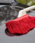 Red All In One Car Duster Detailing Kit with Plastic Handle on car hood for quick dust removal without scratching Model 62445