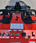 Control panel of Mini Skid Steer Loader 1800 Lb Capacity, 23HP Gas EPA Engine with levers and dials on red dashboard