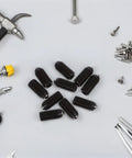 10PC Carbon Steel Ball Head Spring Plunger Grub Screws Featuring Knurled Caps And Load Bearing Springs on a workbench with tools.