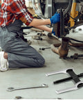 Mechanic using 4 Inch 2 Jaw Gear Puller For Internal And External Removal Of Flywheels Gears Pulleys And Bearings Built Tough In CRV Steel With Reversible Jaws
