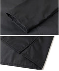 Close-up of sleeves and hem on Durable Mechanic Lab Coat For Men Workwear Long Black Coat For Woodworking Shop Floor Tasks Built From 80 Percent Polyester 20 Percent Cotton Blend Not Flame Resistant With Deep Pockets And Comfortable Fit For Daily Heavy Duty Use.