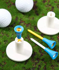 18 Piece Rubber Golf Tees And Tee Holder Kit with plastic tees on artificial turf for indoor outdoor practice