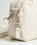 Hella Durable Zinc Alloy Swivel Snap Hooks And D Rings For Purse Hardware, Keychain Crafting, Sewing, 122 Piece Kit With Smooth Turn Clasps, Half Inch Opening, Total Breeze To Use attached to a beige bag