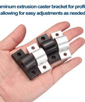 Hand holding aluminum extrusion caster brackets for profiles, showing black and silver finish, part of Six Pack M8 T Slot Leg Connectors Kit