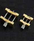 Pro Grade Extensible Brass Watch Movement Holders Set for Precise Repair and Assembly, adjustable clamps on black surface.