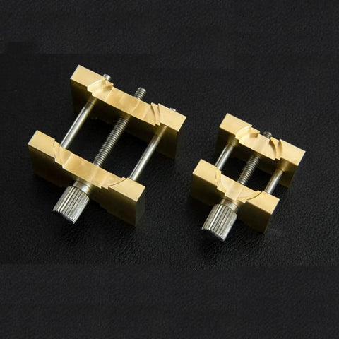 Pro Grade Extensible Brass Watch Movement Holders Set for Precise Repair and Assembly, adjustable clamps on black surface.