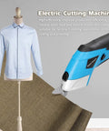 Cordless Electric Scissors With Knockout Power For Zero Fuss Fabric Cutting And Cardboard Trimming Featuring Dual Angle Blades used on a fabric piece and shirt.