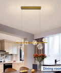 Dope Modern 5-Light Chandelier Fixture With Brushed Nickel Finish And Glass Shades in dining room setting.